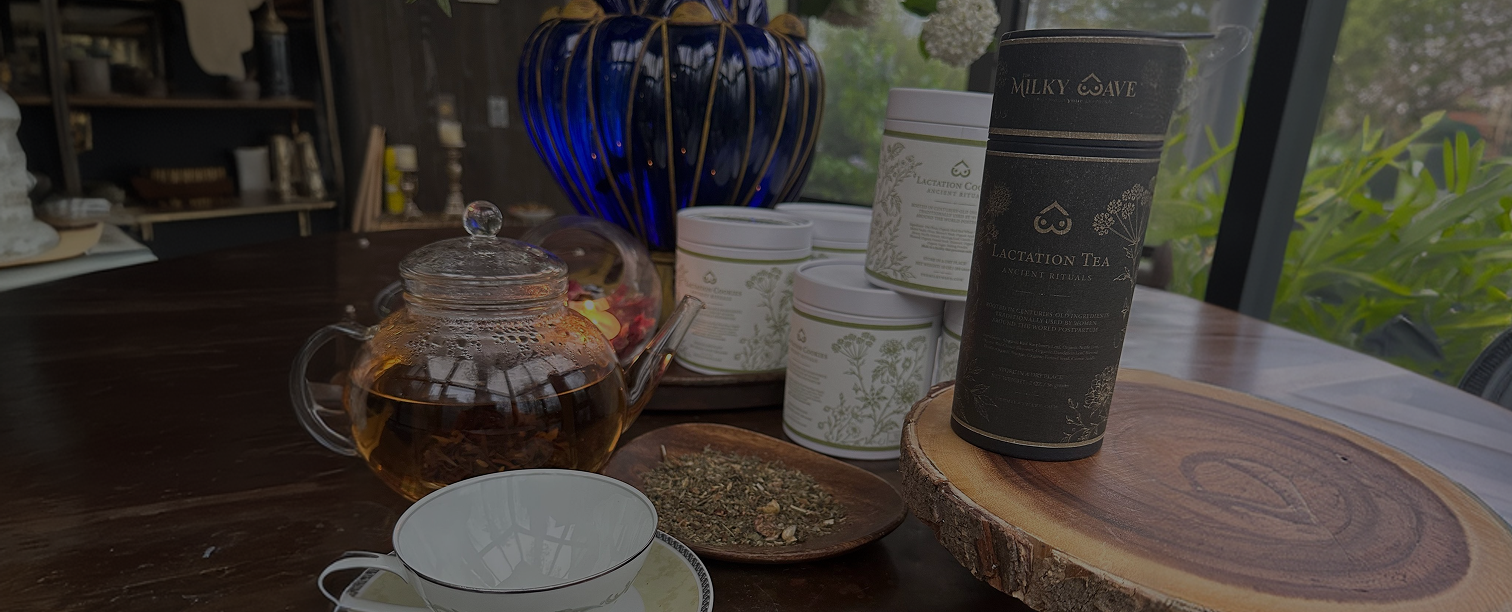 The Milky Wave lactation tea with teapot, loose herbs, and product jars on a table